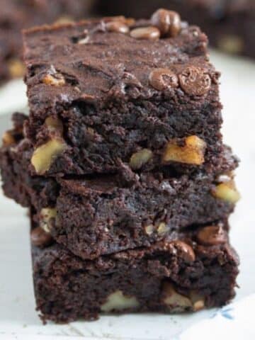 three moist sweet potato brownies stapled over each other.