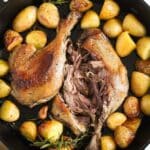 confit de canard duck legs served with roast potatoes.