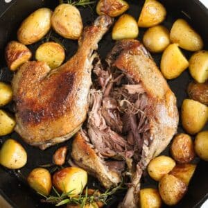 confit de canard duck legs served with roast potatoes.