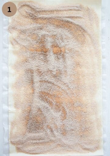 a sheet of puff pastry sprinkled with sugar and cinnamon.