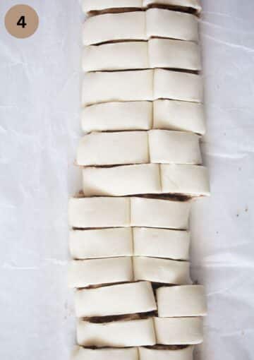 cut french heart cookies from a log of puff pastry before taking them apart.