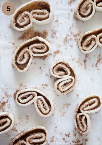 unbaked french heart cookies on the table.