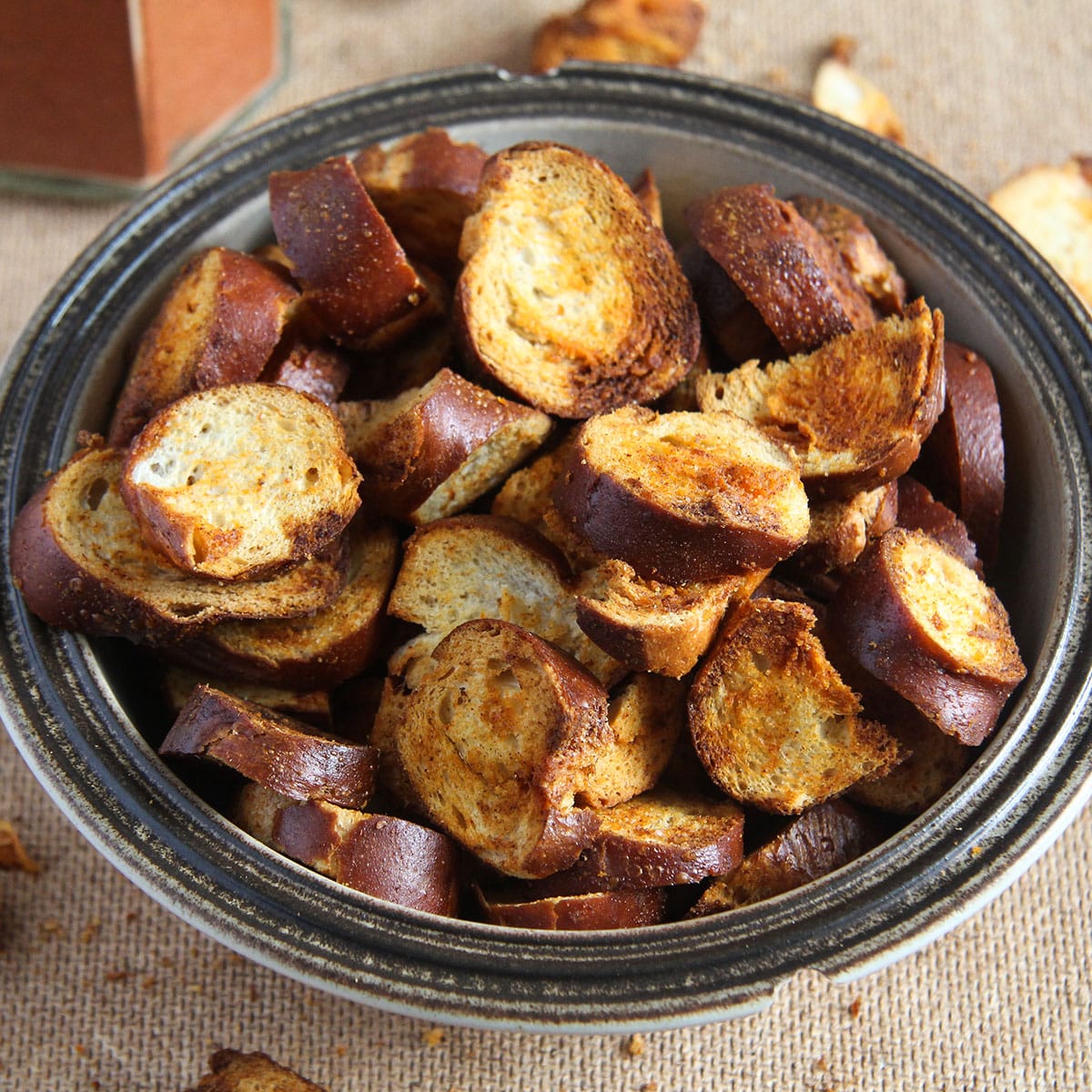 bowl with leftover soft pretzel chiips baked and spicy.