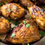 nando's chicken thighs sprinkled with parsley.