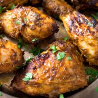 nando's chicken thighs sprinkled with parsley.