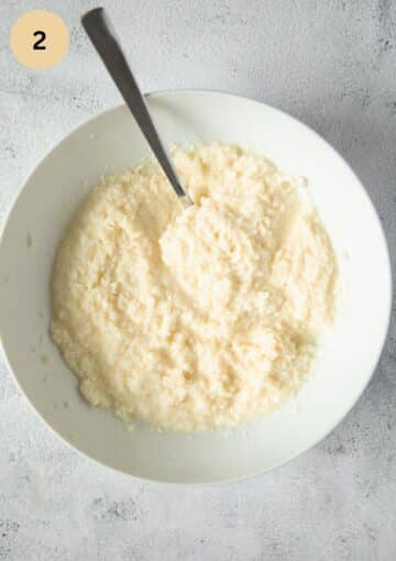 sweetened condensed milk and coconut mixture in a white bowl.