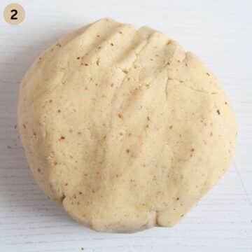 a ball of smooth hazelnut dough for making vanillekipferl on the table.
