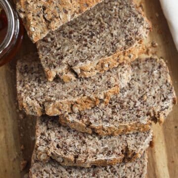 buckwheat bread cut into slices on a wooden board.