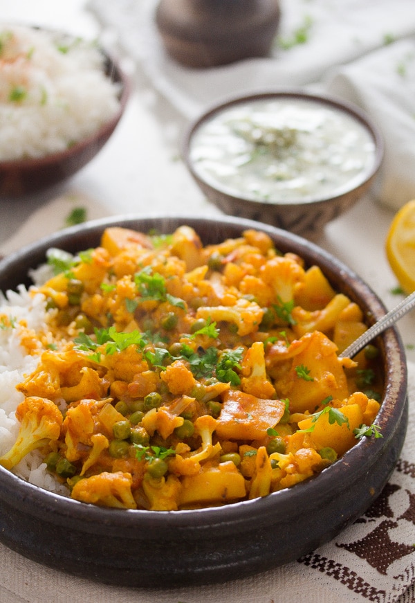 vegan cauliflower curry in a bowl with rice