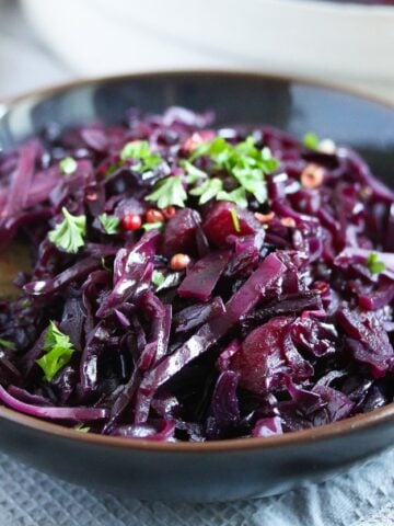 german red cabbage sprinkled with parsley in a bowl.