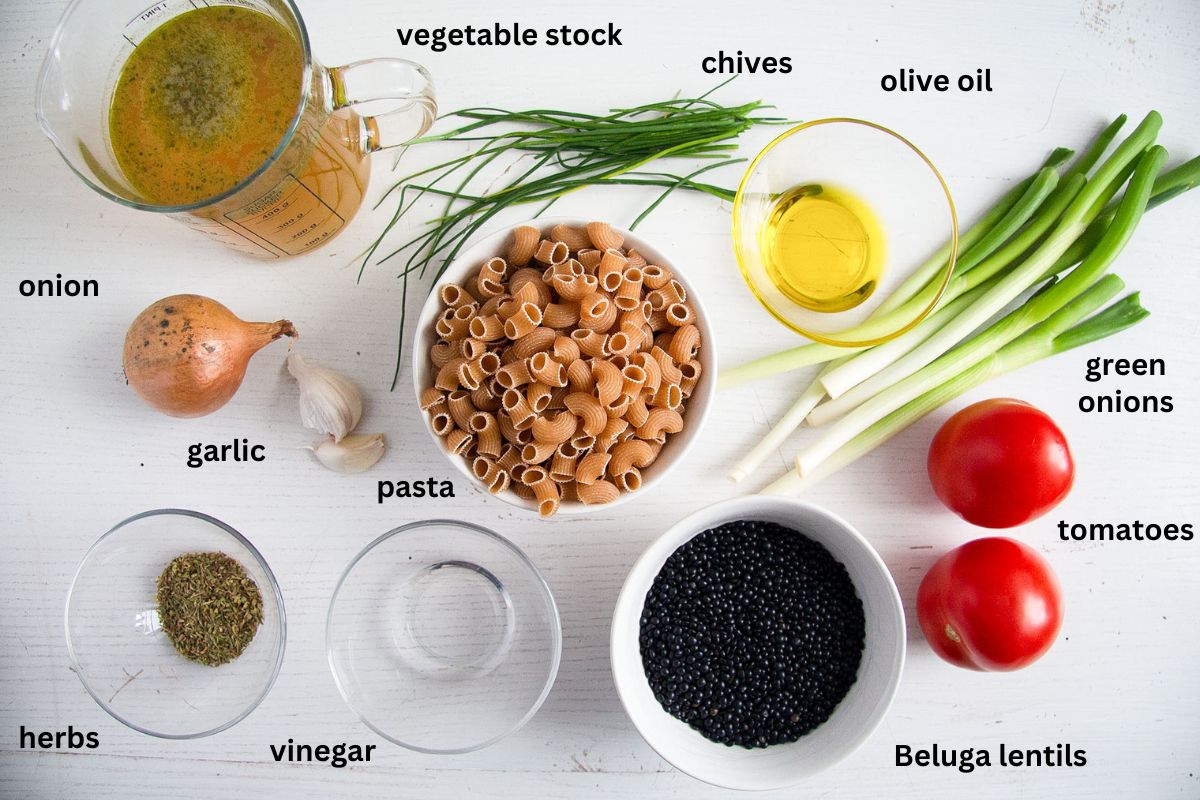 listed ingredients for making lentil soup with pasta, vegetbles and herbs.