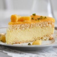slice of mango mousse cake on a plate