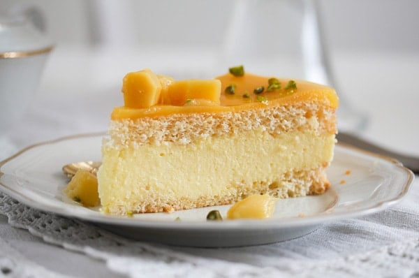 slice of mango mousse cake on a plate