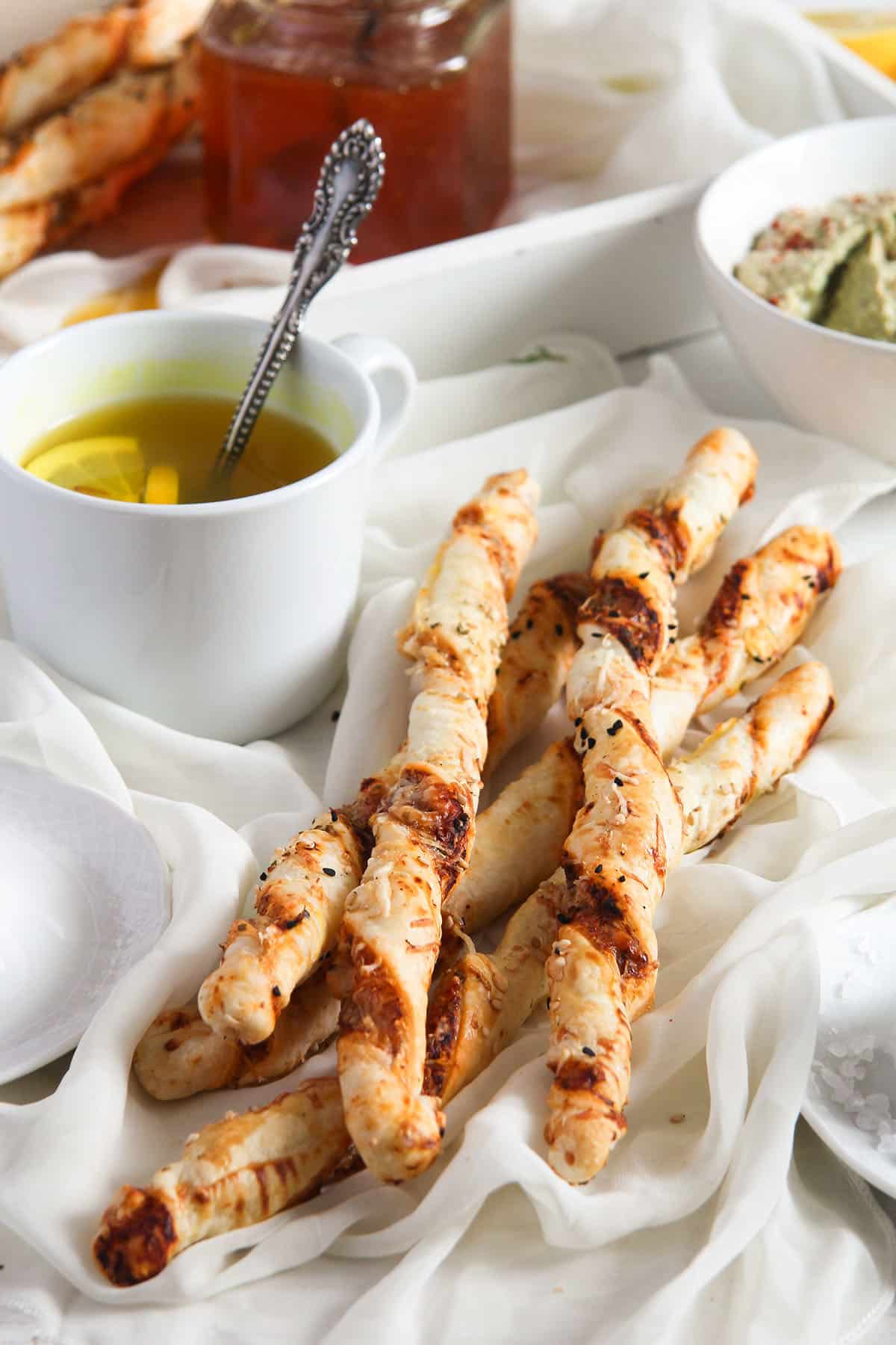 pizza twists and a cup of tea on the table.