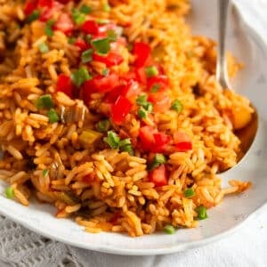 bbq rice topped with diced tomatoes and chopped parsley.