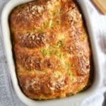 golden brown crescent roll breakfast casserole in a baking dish.
