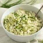 german coleslaw with parsley in a bowl.