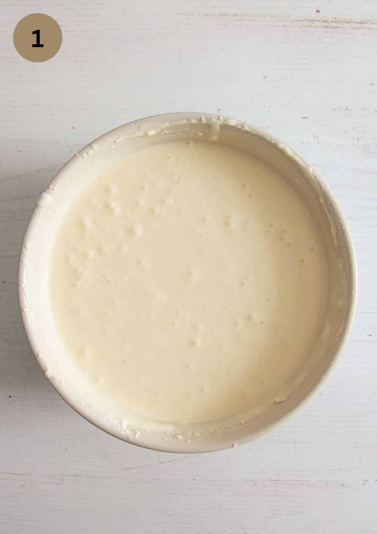 batter for crustless cheesecake in a large bowl.