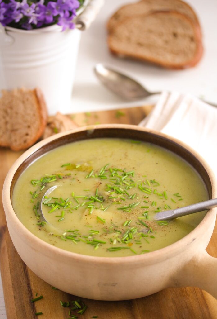 potato soup with leeks in a brown pot