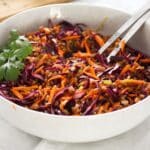 spelt grain salad with red cabbage and carrots in a large bowl.