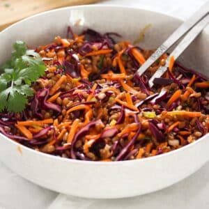 spelt grain salad with red cabbage and carrots in a large bowl.