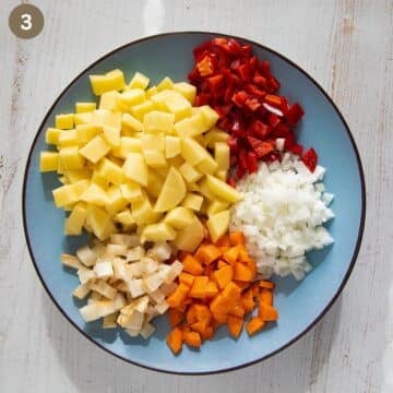 chopped poatoes, pepper, onion, celerian and carrot for making soup with bone broth.