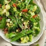 broccoli and pea salad with tomatoes and vinaigrette.