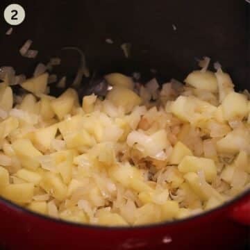 sauteing sauerkraut with apples and grated potatoes in a pot.