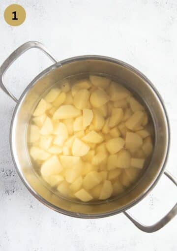cubed potatoes in a pot of water.