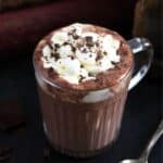 irish hot chocolate topped with cream and chocolate shavings in a cup.