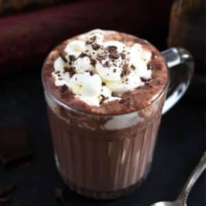 irish hot chocolate topped with cream and chocolate shavings in a cup.