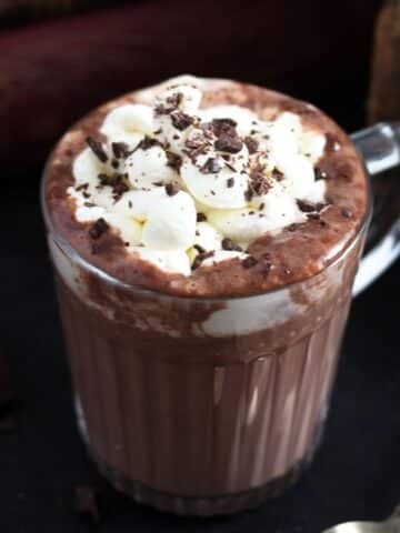 irish hot chocolate topped with cream and chocolate shavings in a cup.