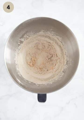 barely mixed dough for making pasca recipe in a mixing bowl.