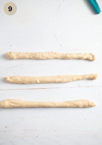 Dividing and rolling the dough to shape the braid.