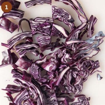 shredded red cabbage on a board.