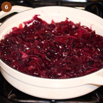 braised german red cabbage in a white dutch oven.