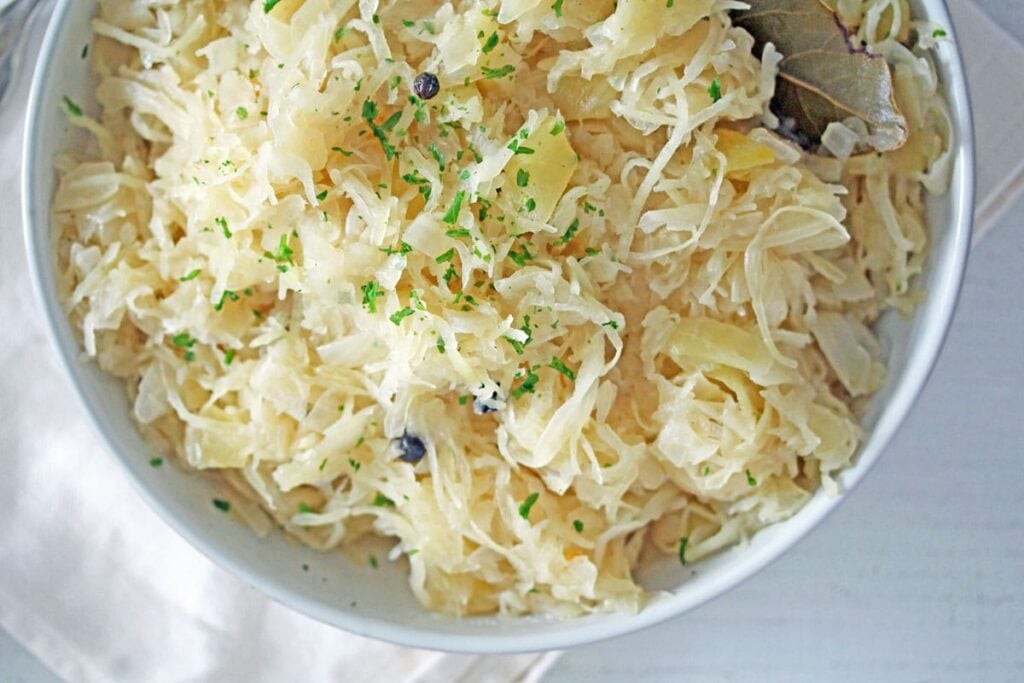 cooked pickled cabbage in a white bowl