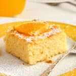 pinterest image of orange cake with cornmeal.