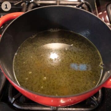 asparagus stock simmering in a soup pot.