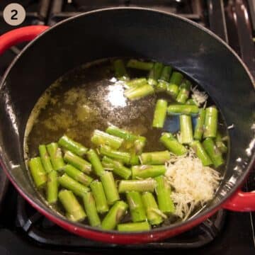asparagus pieces cooking in stock to make soup.