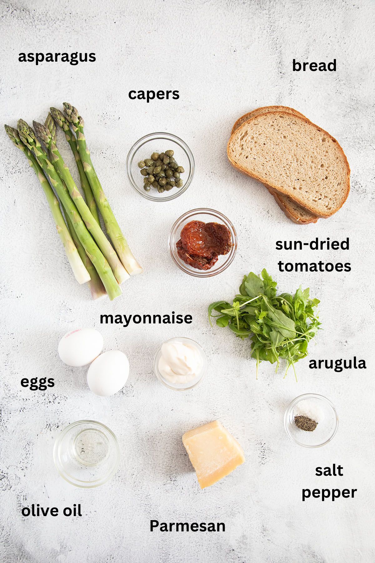 listed ingredients for making toast with asparagus, eggs and parmesan.