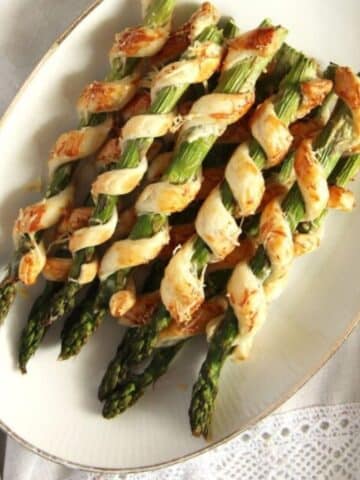asparagus puff pastry twists on a vintage platter.