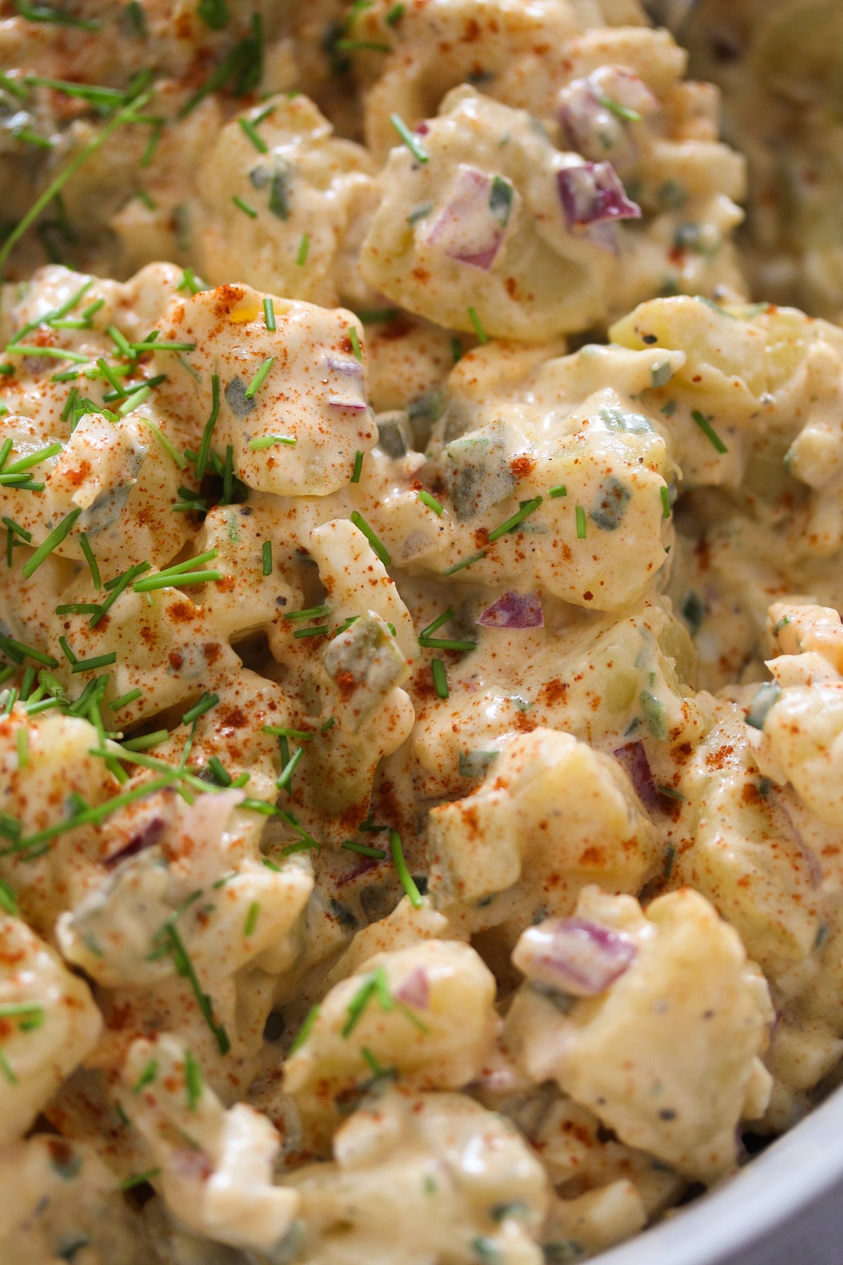 close up chunks of potatoes with mayonnaise dressing