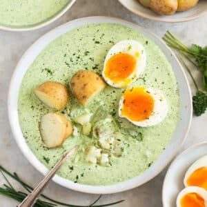 frankfurter green sauce served with boiled potatoes and boiled egg halves.