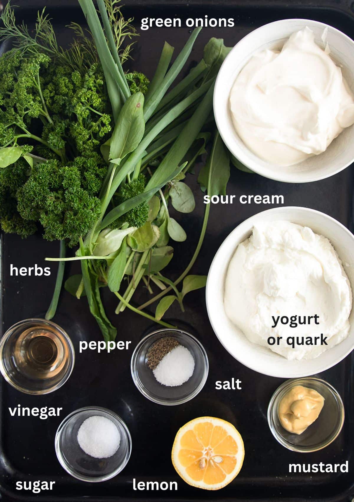 labeled ingredients for making green sauce with frankfurter herbs, dairy, mustard, and lemon.