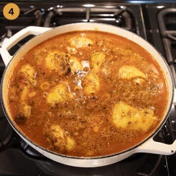 adding stock to rice and chicken in a large pot.
