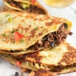 pinterest image with title of beef quesadillas.