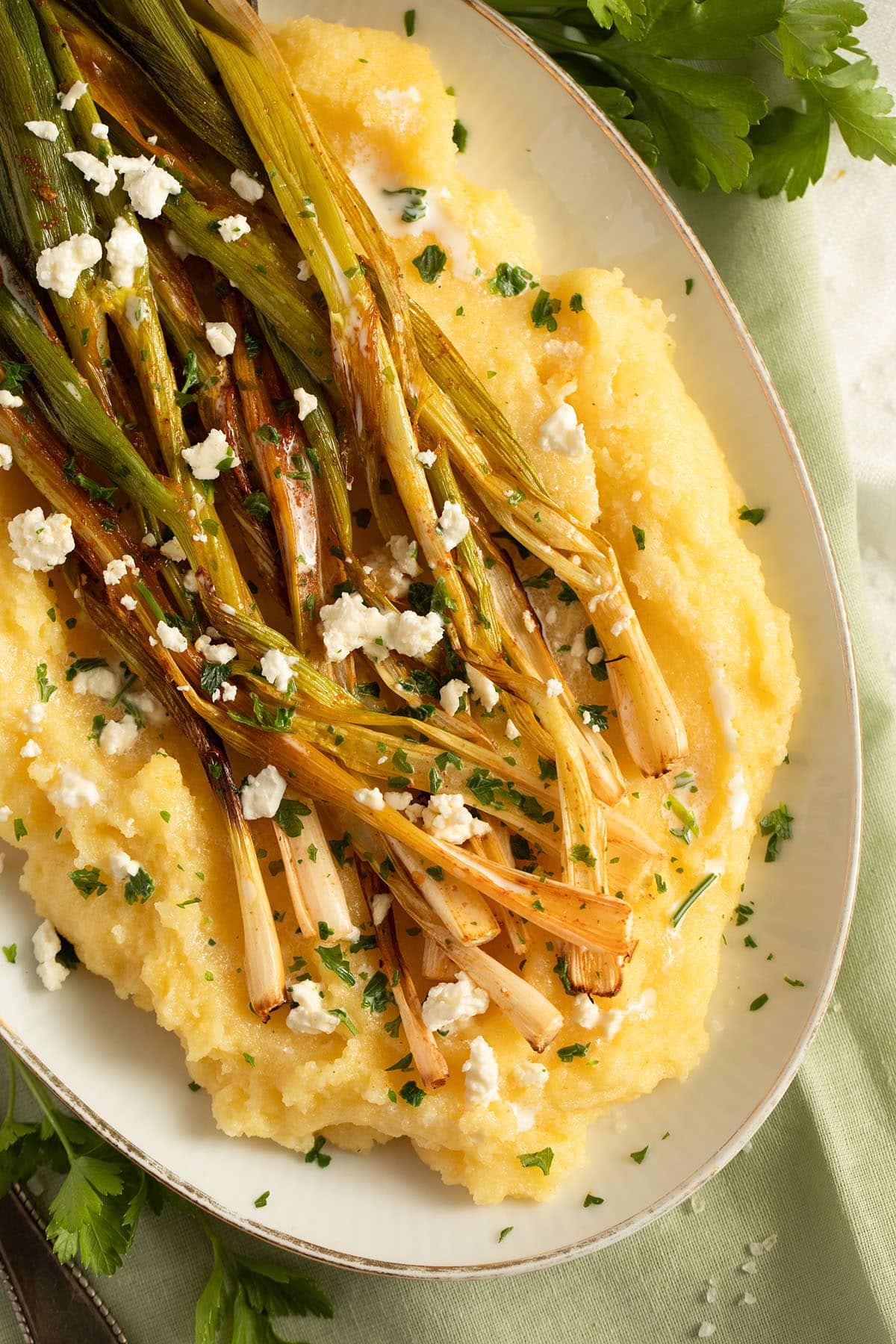 green onions on polenta with cheese.