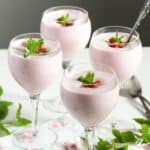 romanian strawberry foam in four champagne glasses.