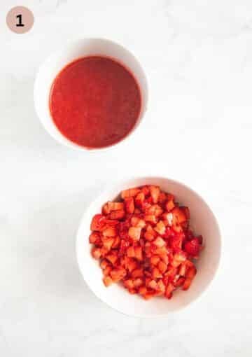 one bowl wth strawberry puree and one with chopped strawberries for tiramisu.